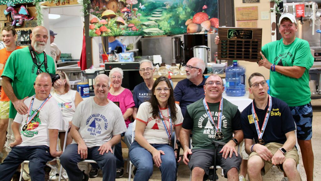 Group of happy people at community event indoors.