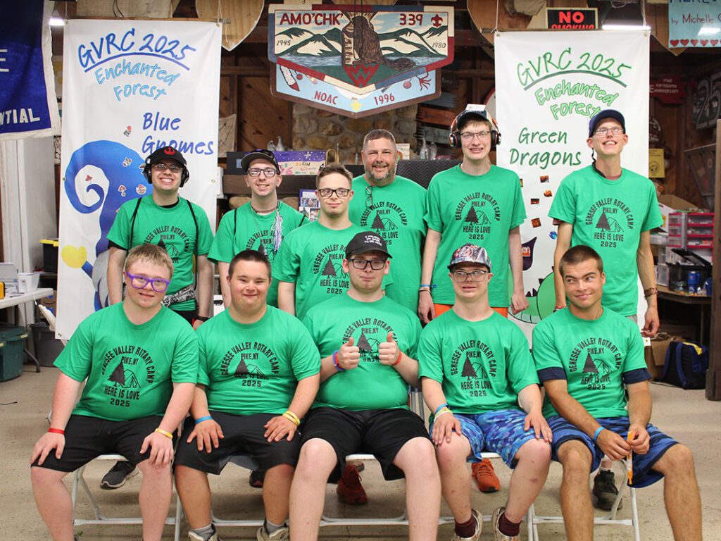 Group photo at summer camp with matching shirts.