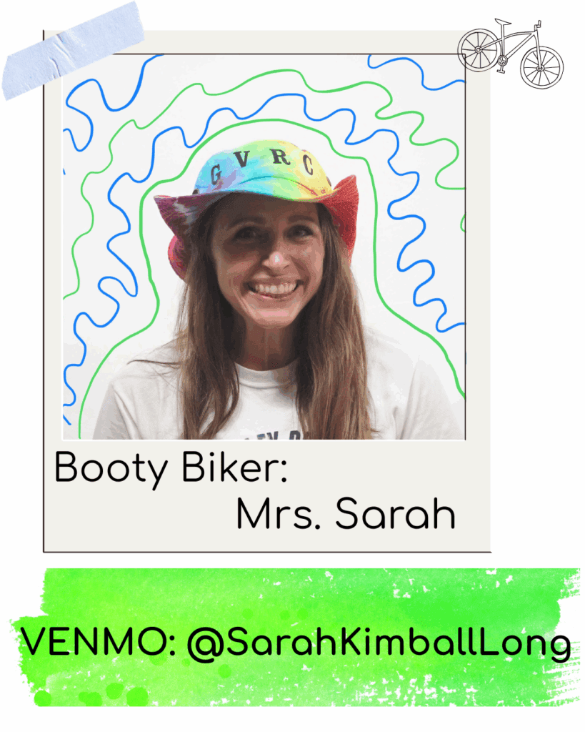 Smiling woman in colorful hat with biking theme.