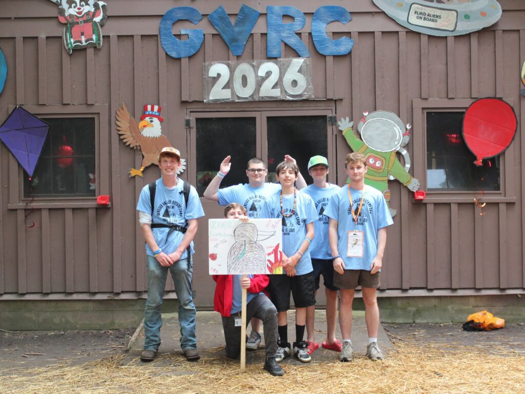 Campers pose before a space-themed GYRC 2026 backdrop.